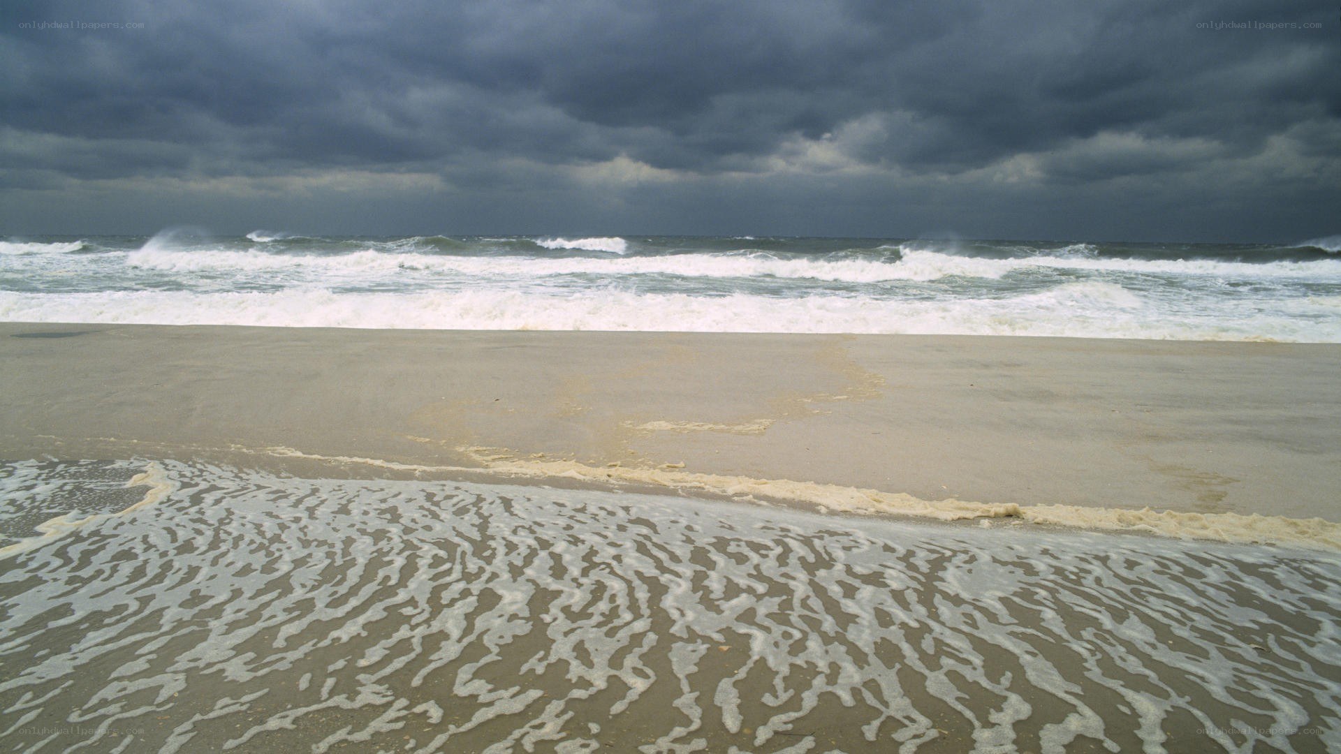 Stormy beach with crashing waves