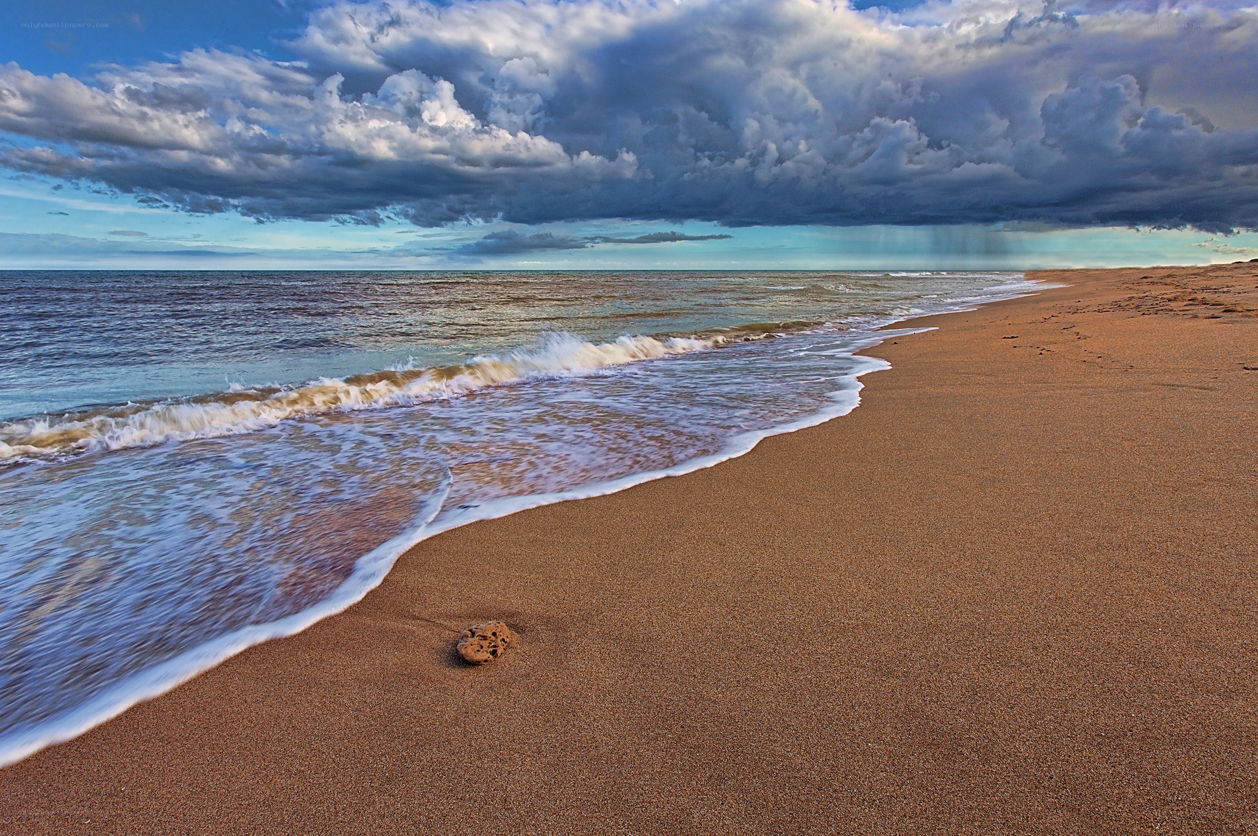 Stormy beach with crashing waves