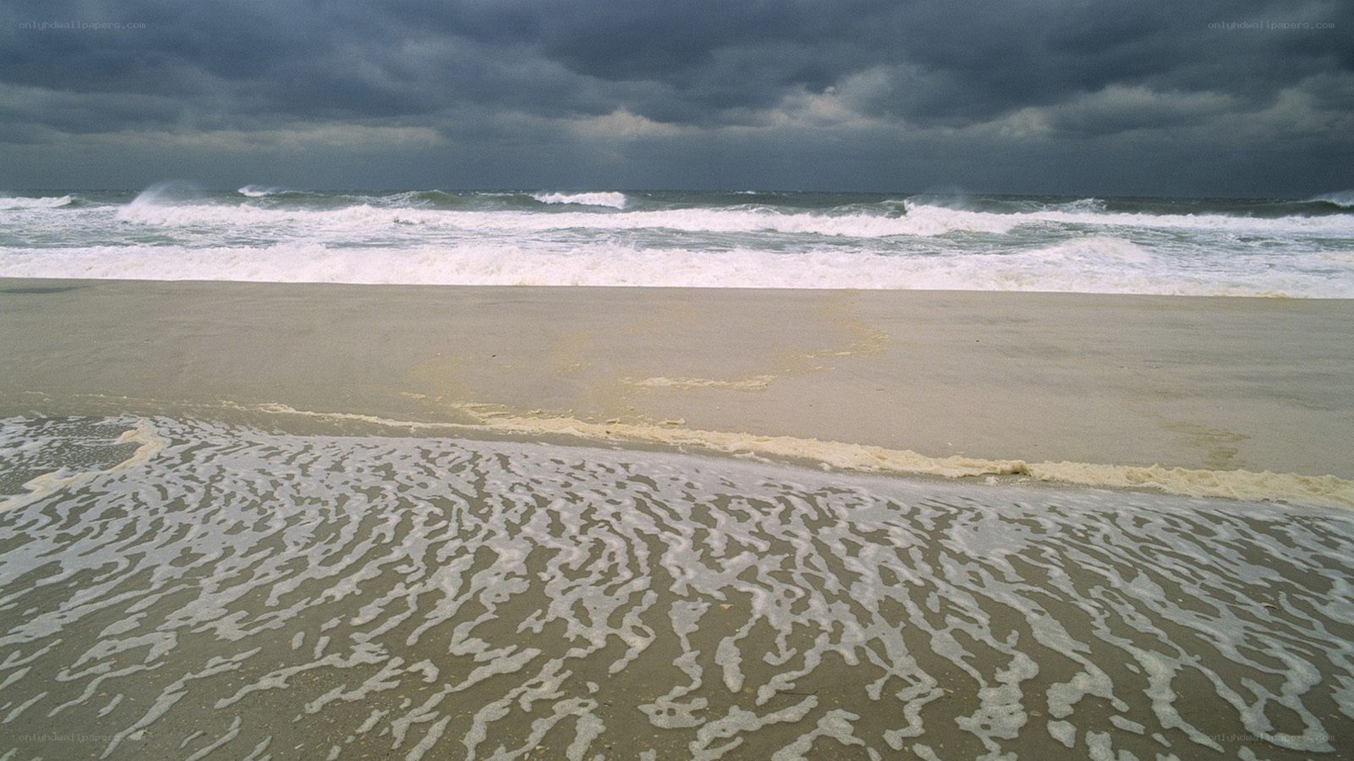 Stormy beach with crashing waves