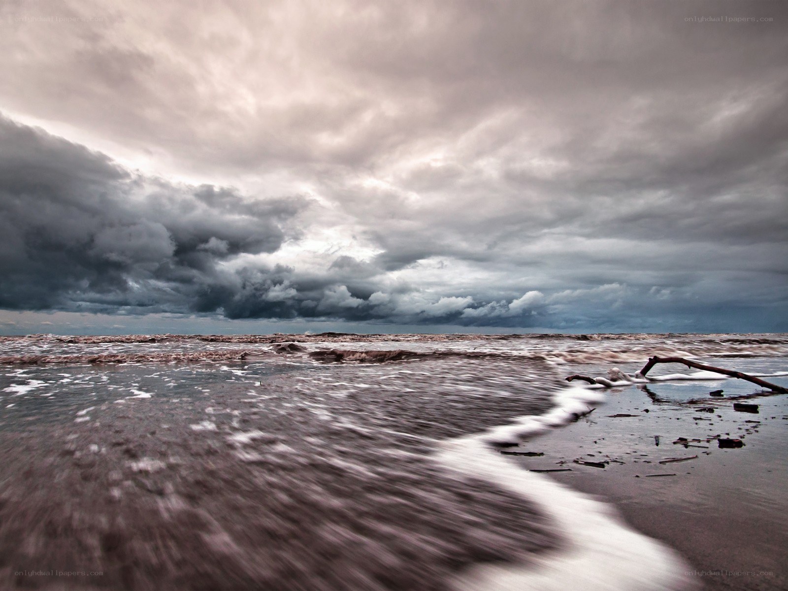 Stormy beach with dark clouds