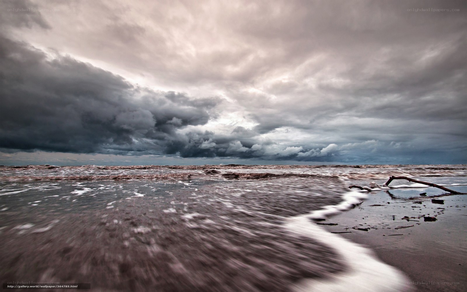 Stormy beach with dark clouds