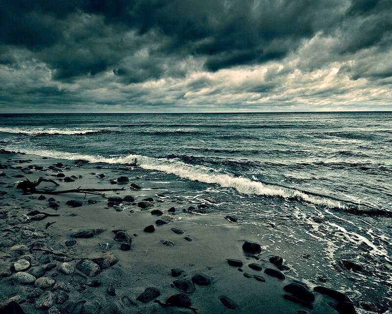 Stormy beach with dark clouds