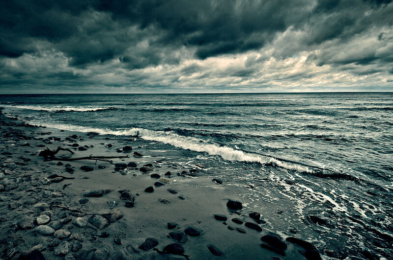 Stormy beach with dark clouds