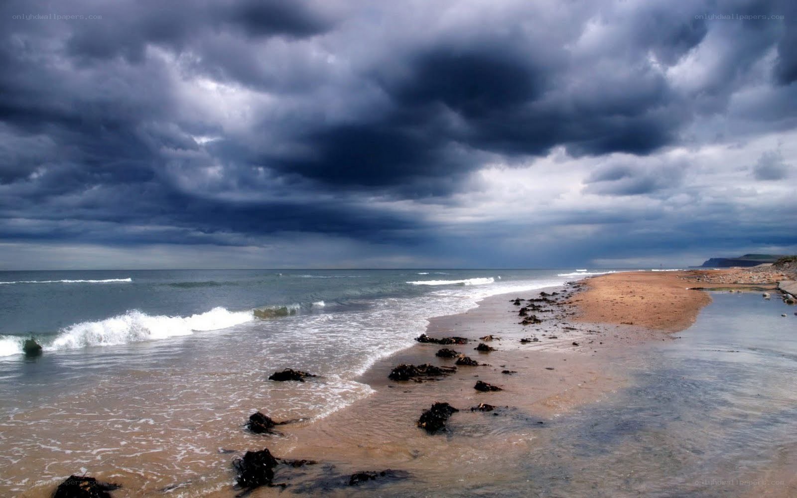 Stormy beach with dark clouds