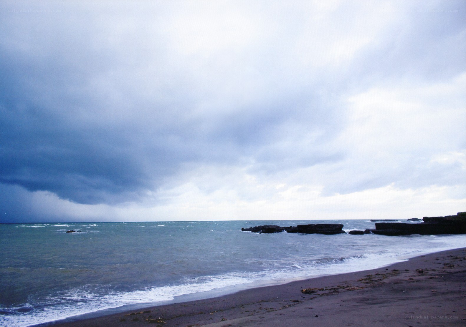 stormy beach with dark clouds
