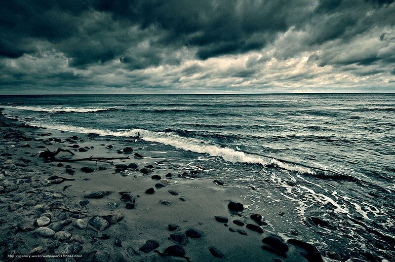 Stormy beach with dark clouds
