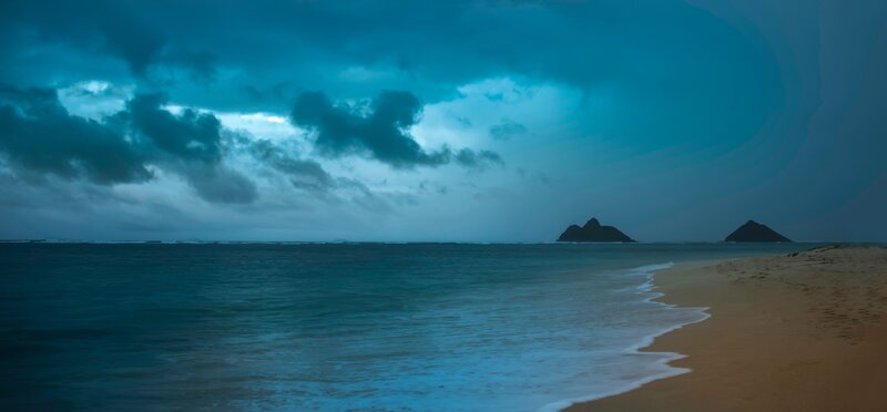 Stormy beach with distant islands