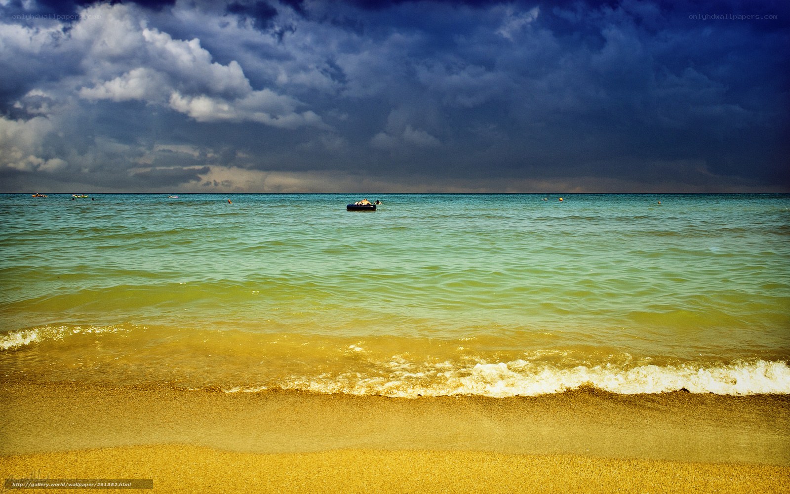 Stormy beach with inflatable boat