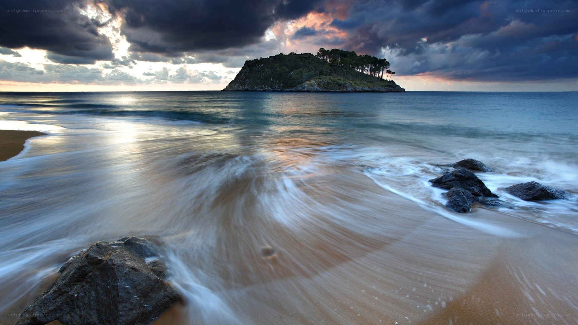 Stormy beach with island