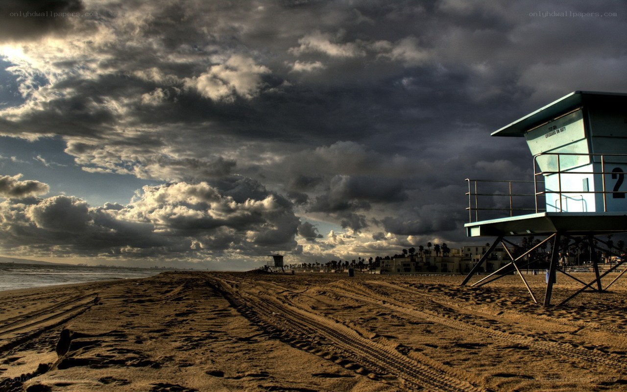 Stormy beach with lifeguard tower