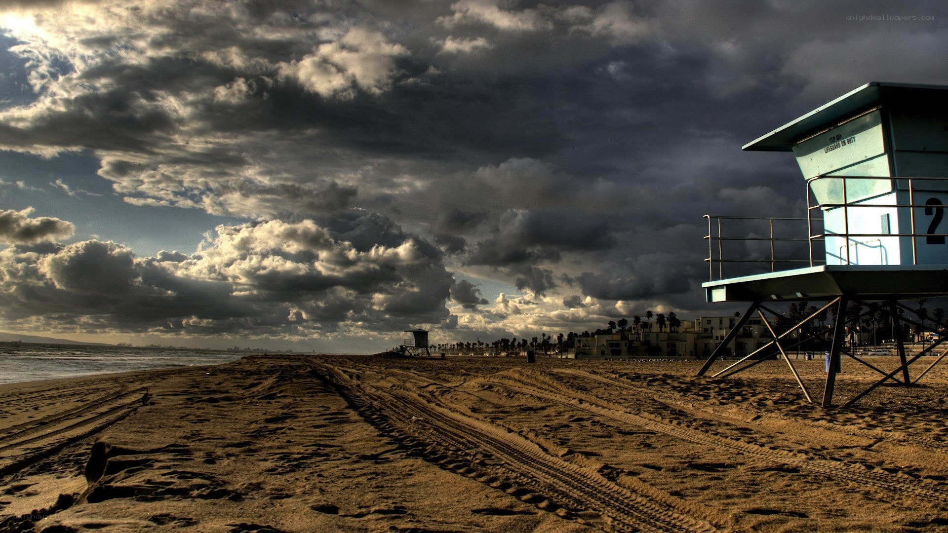 Stormy beach with lifeguard tower