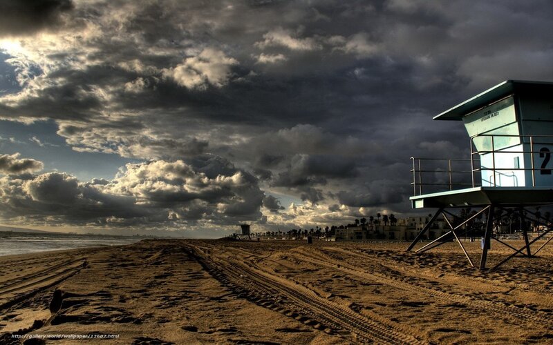 Stormy beach with lifeguard tower