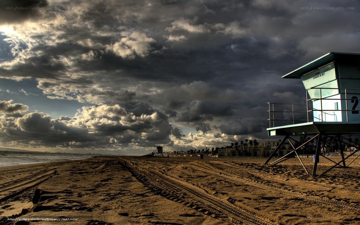 Stormy beach with lifeguard tower