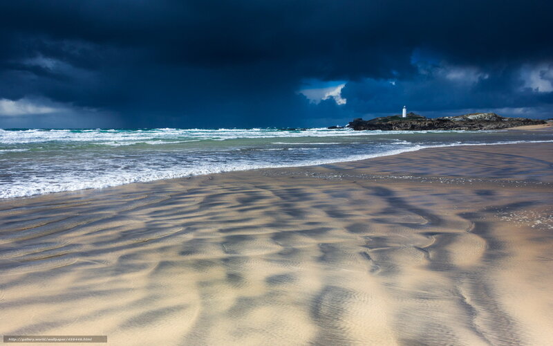 Stormy beach with lighthouse