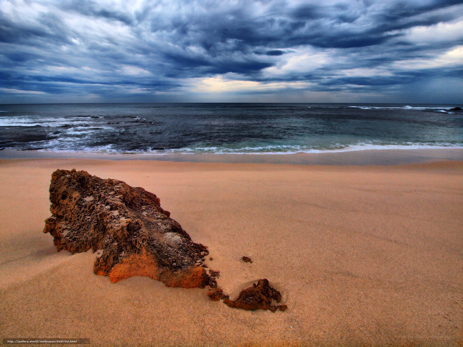 Stormy beach with rock