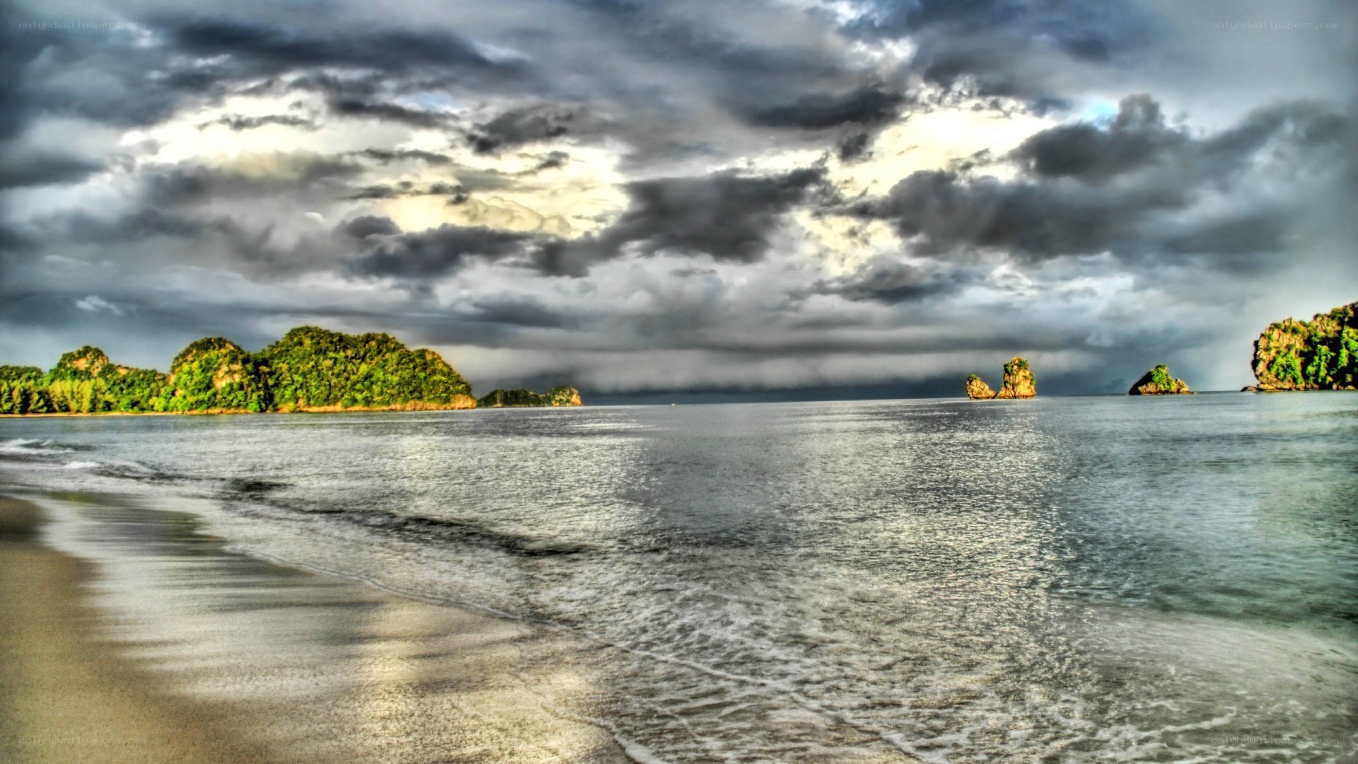 Stormy beach with rocky islands