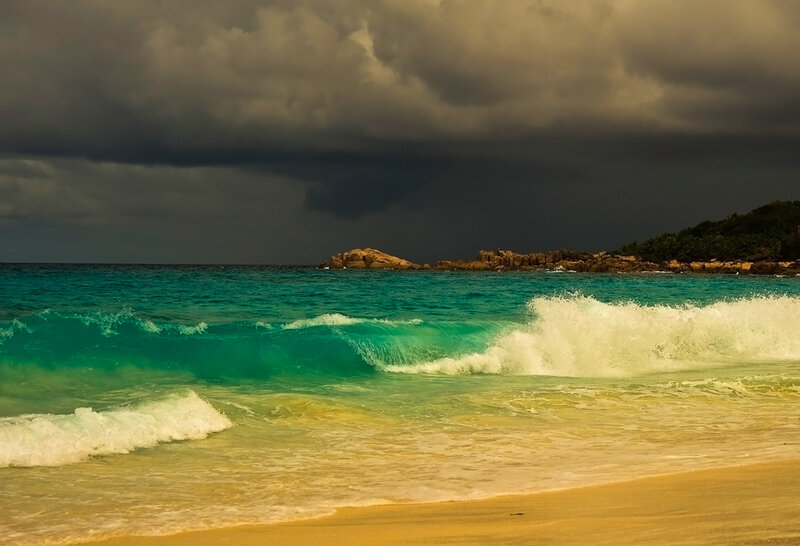 Stormy beach with turquoise waves