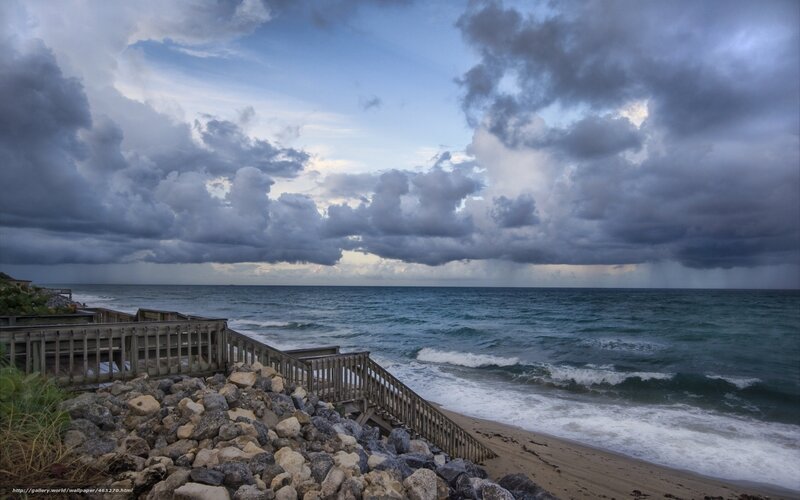 Stormy beach with wooden stairs