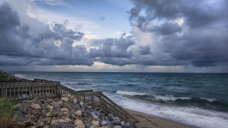 Stormy beach with wooden stairs