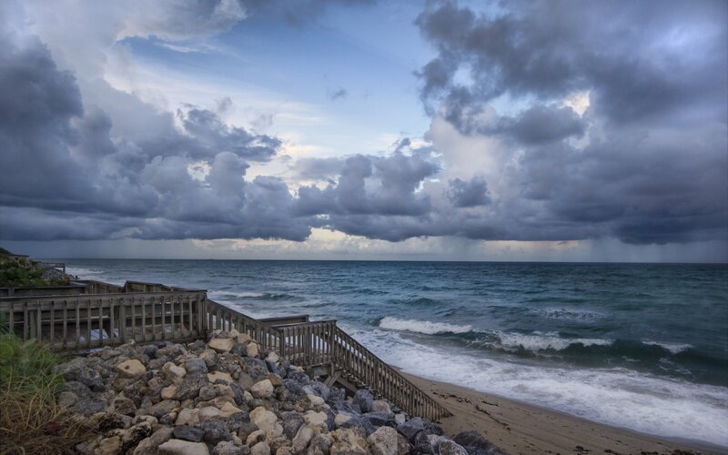 Stormy beach with wooden walkway