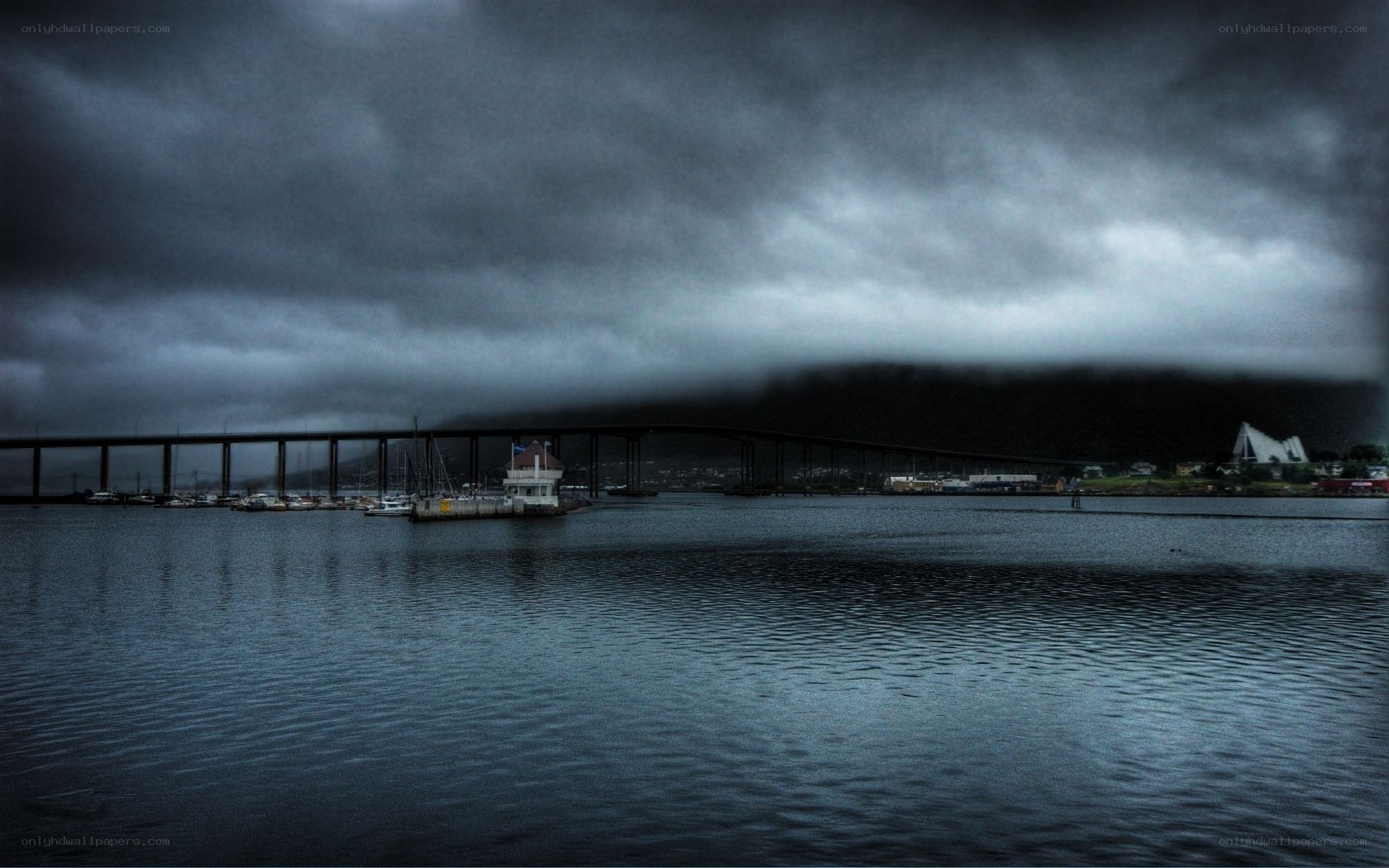 Stormy bridge over water