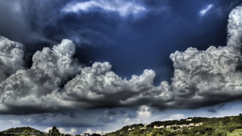 Stormy clouds over a hillside