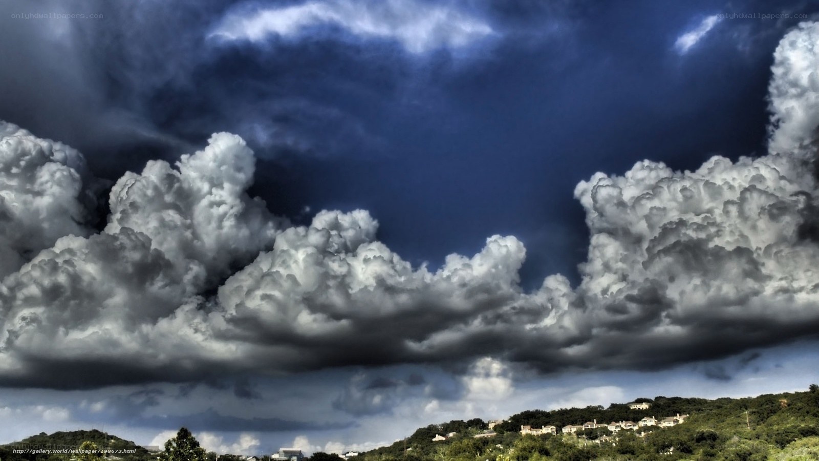 Stormy clouds over a hillside