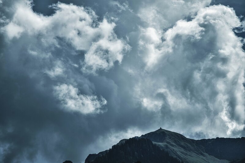 Stormy clouds over mountain peak