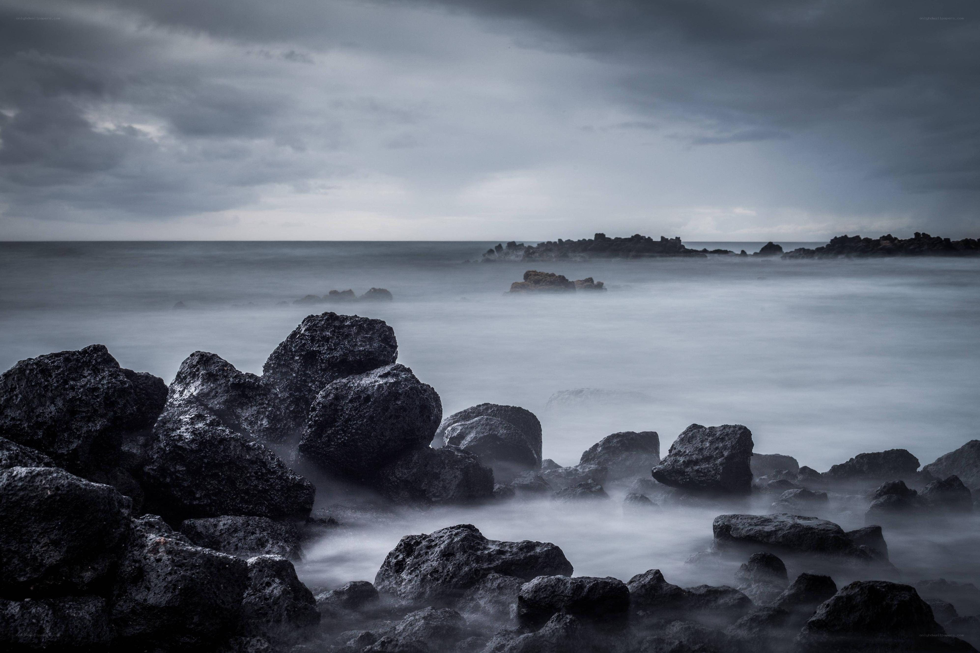 Stormy coast with dark rocks