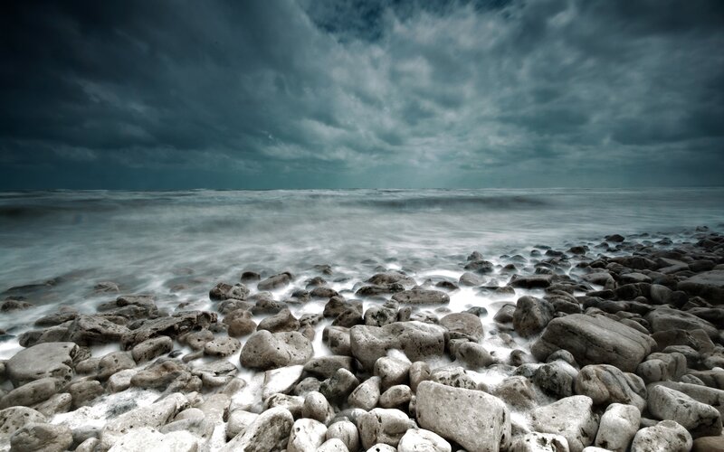 Stormy coast with pebbles