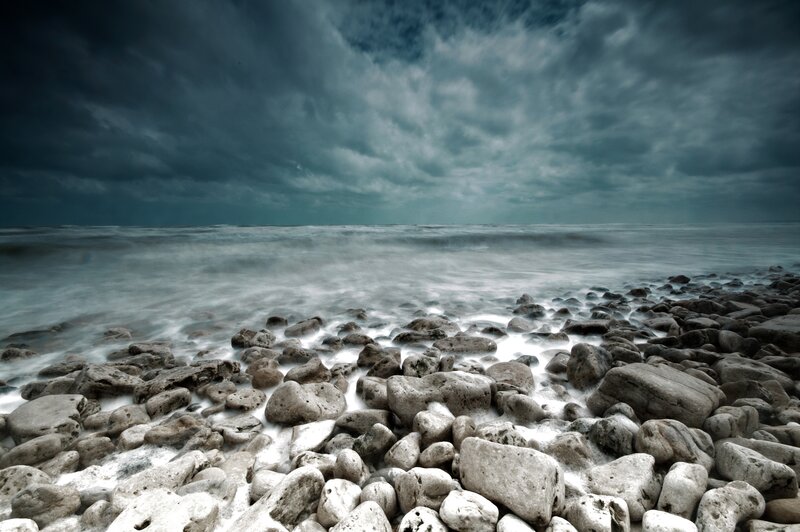 Stormy coast with pebbles