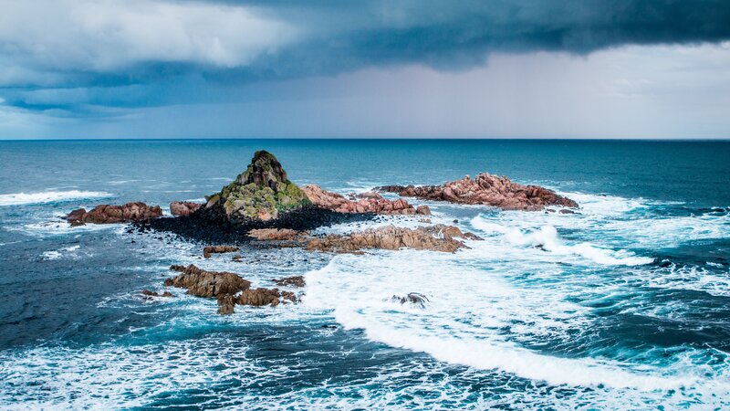 Stormy coast with rocky islets