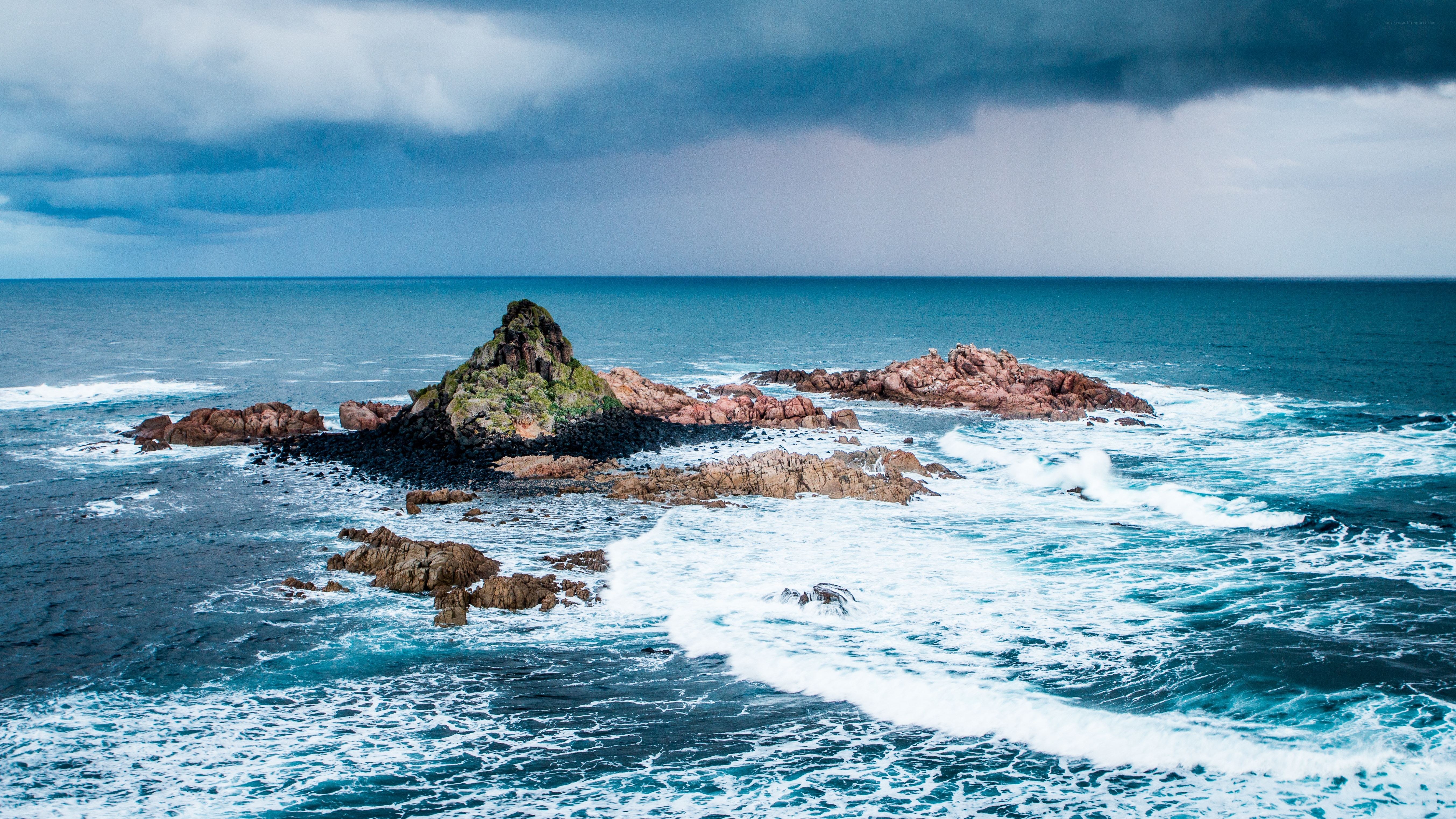 Stormy coast with rocky islets