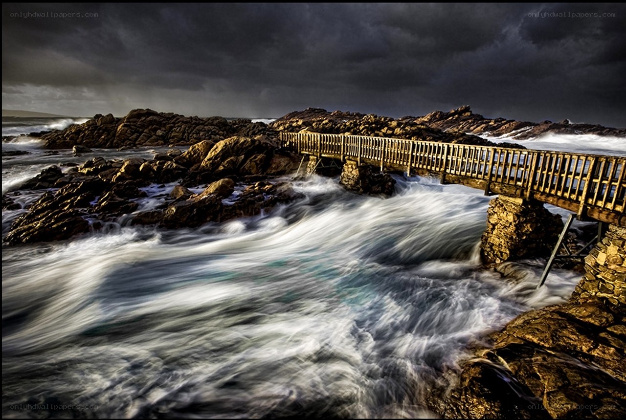 Stormy coastal bridge scene