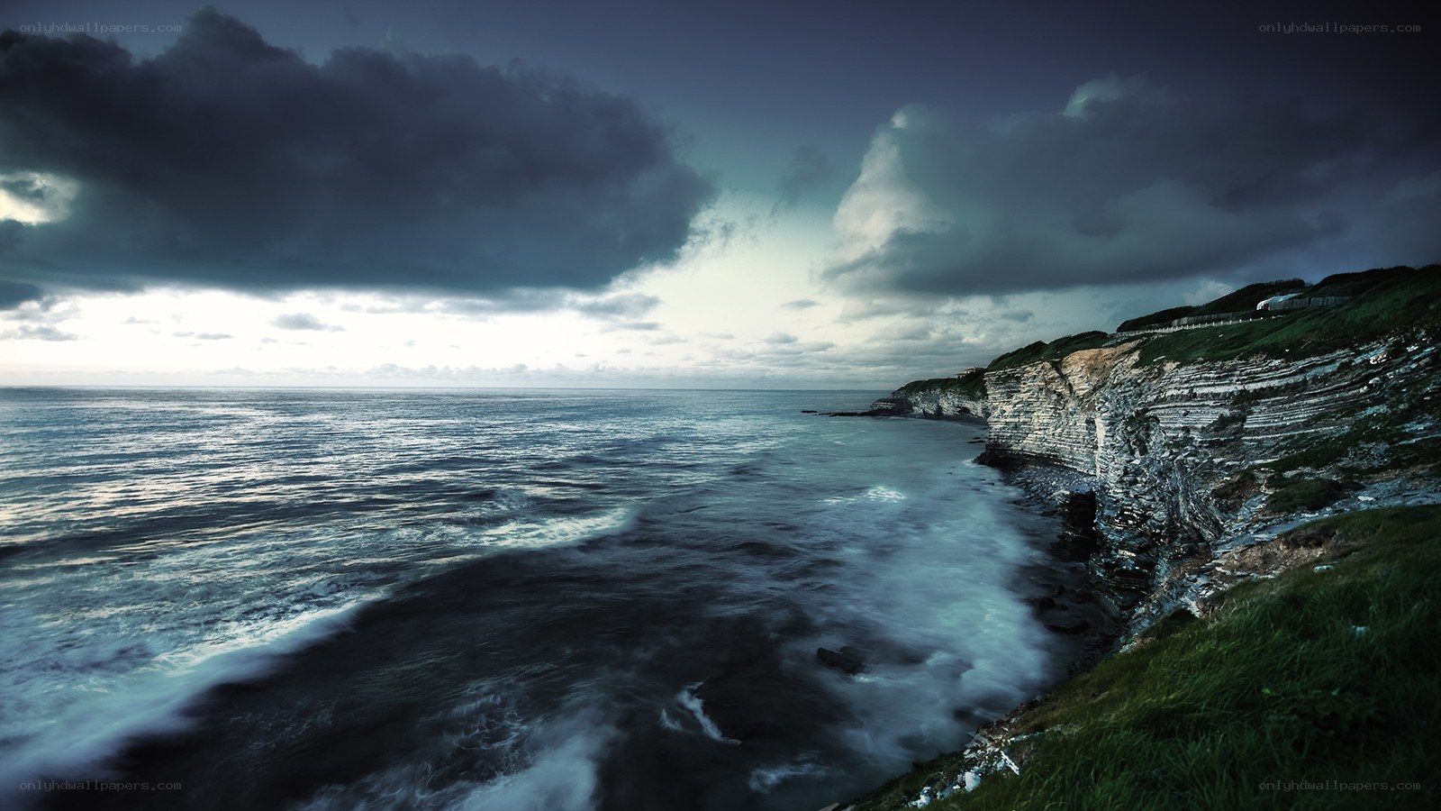 Stormy coastal cliffs at dusk