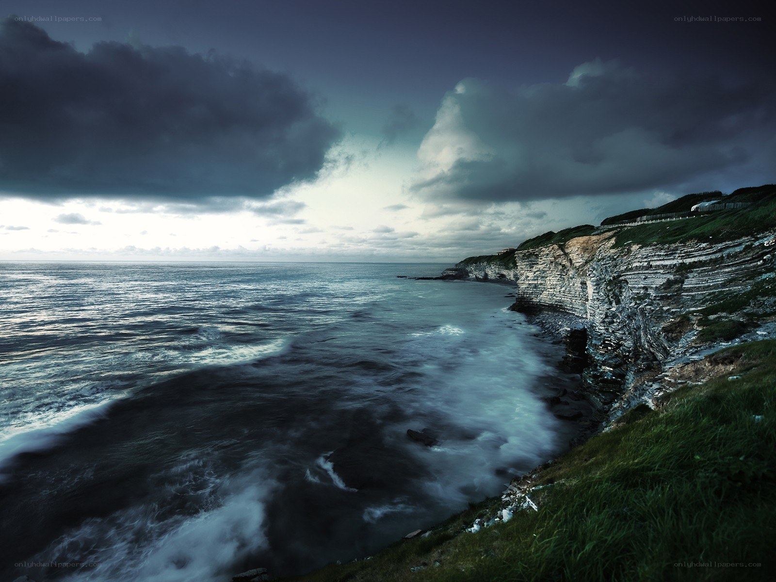 Stormy coastal cliffs at dusk