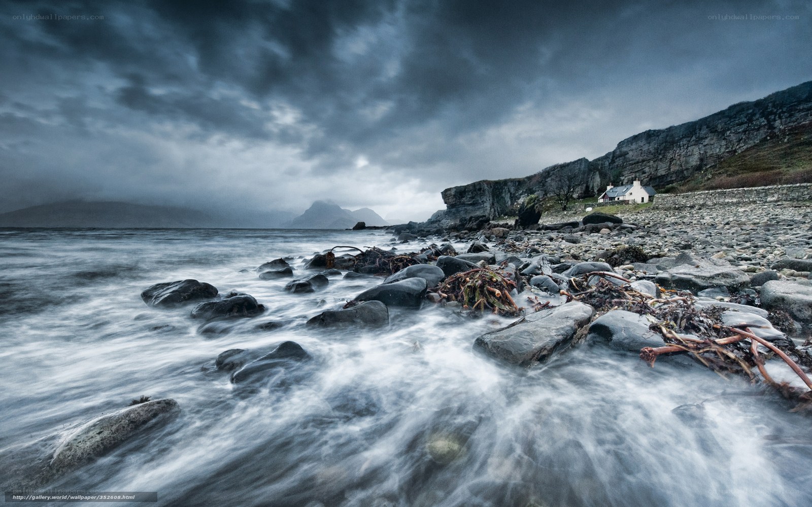 Stormy coastal landscape with cottage