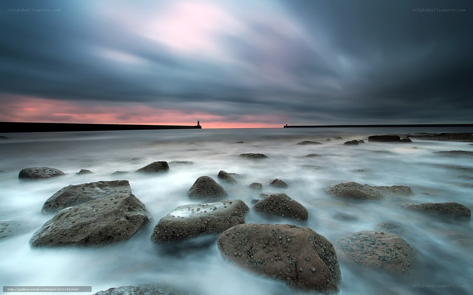 Stormy coastal rocks at sunset