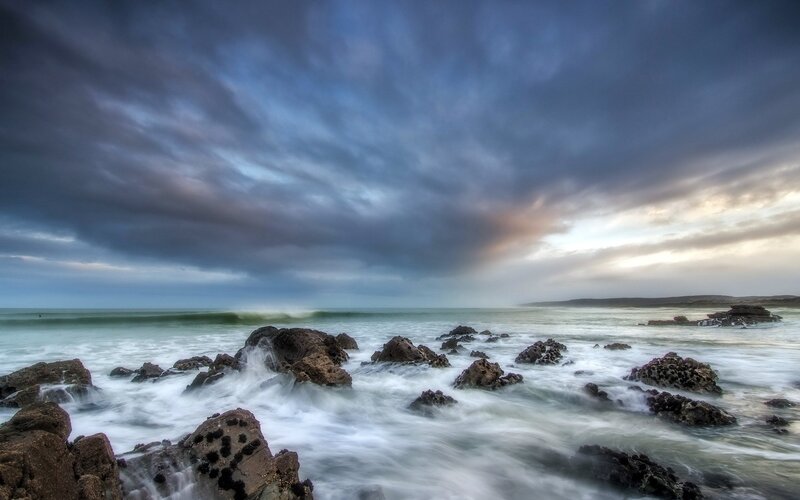 Stormy coastal waves at dusk
