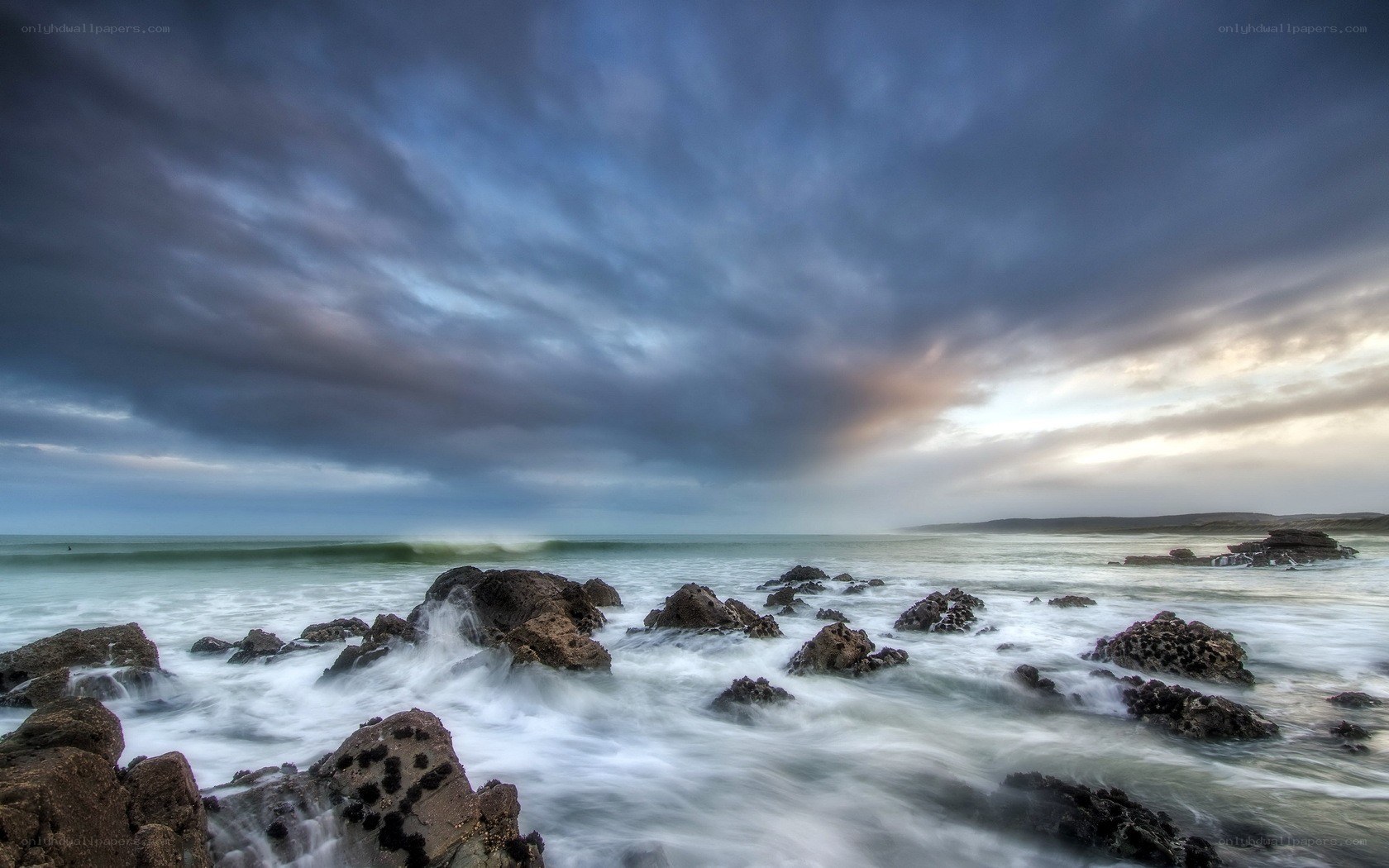 Stormy coastal waves at dusk