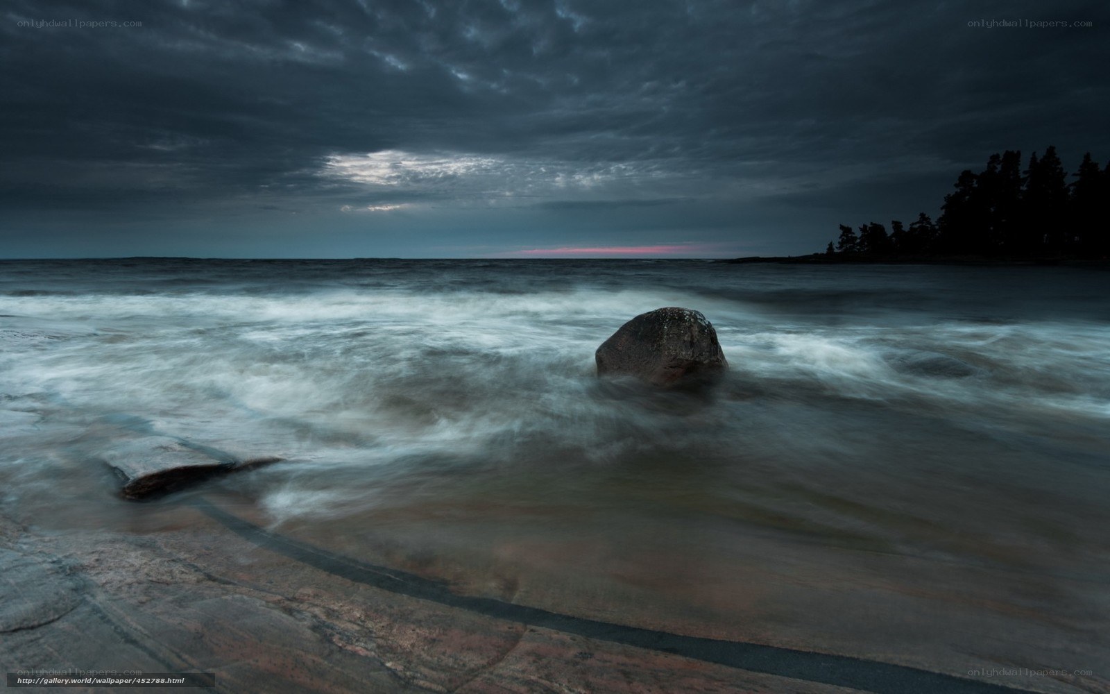 Stormy coastal waves at dusk