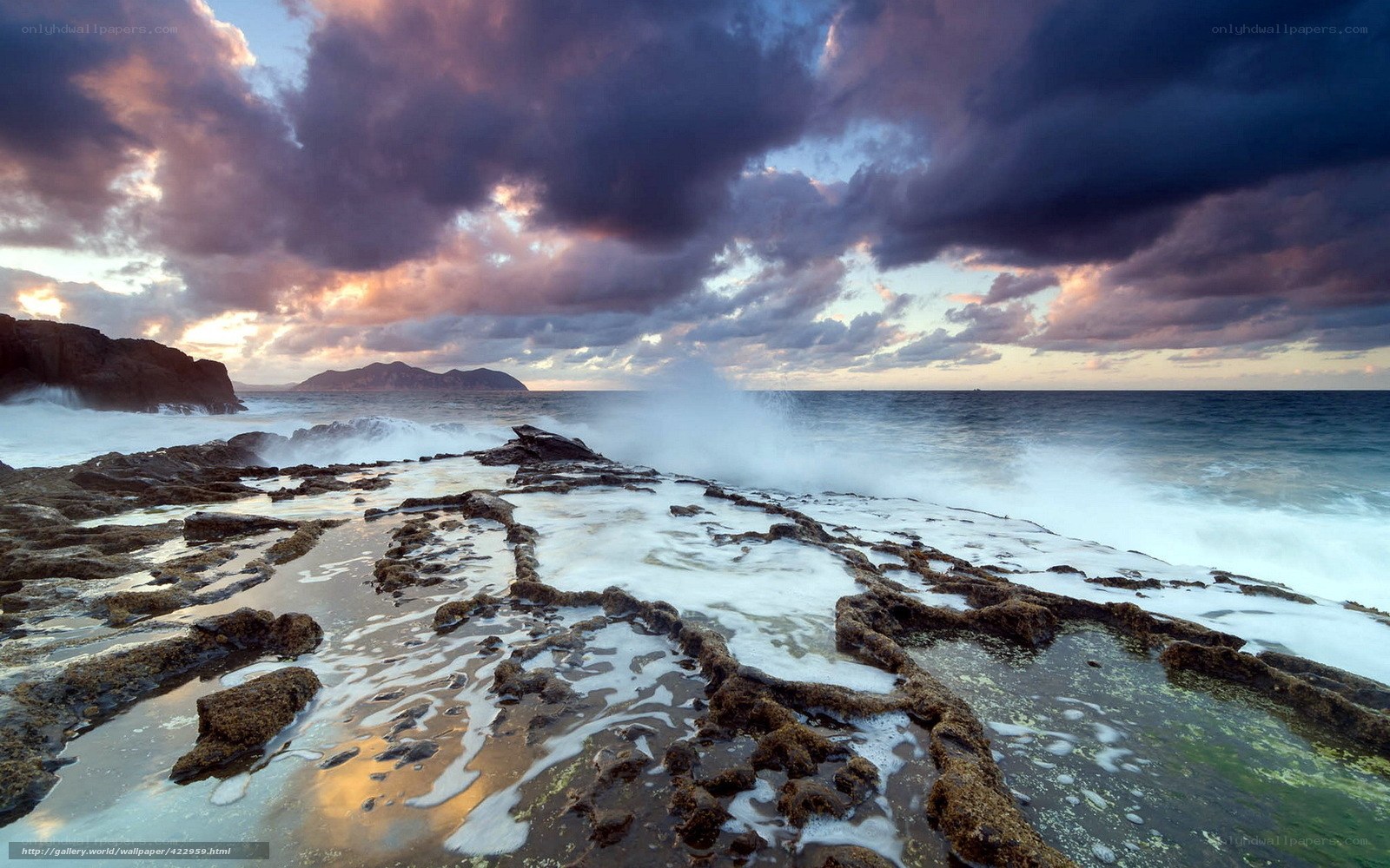 Stormy coastal waves at sunset