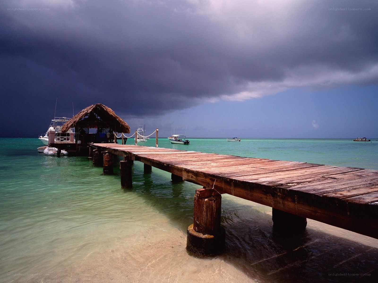 Stormy dock at tropical beach