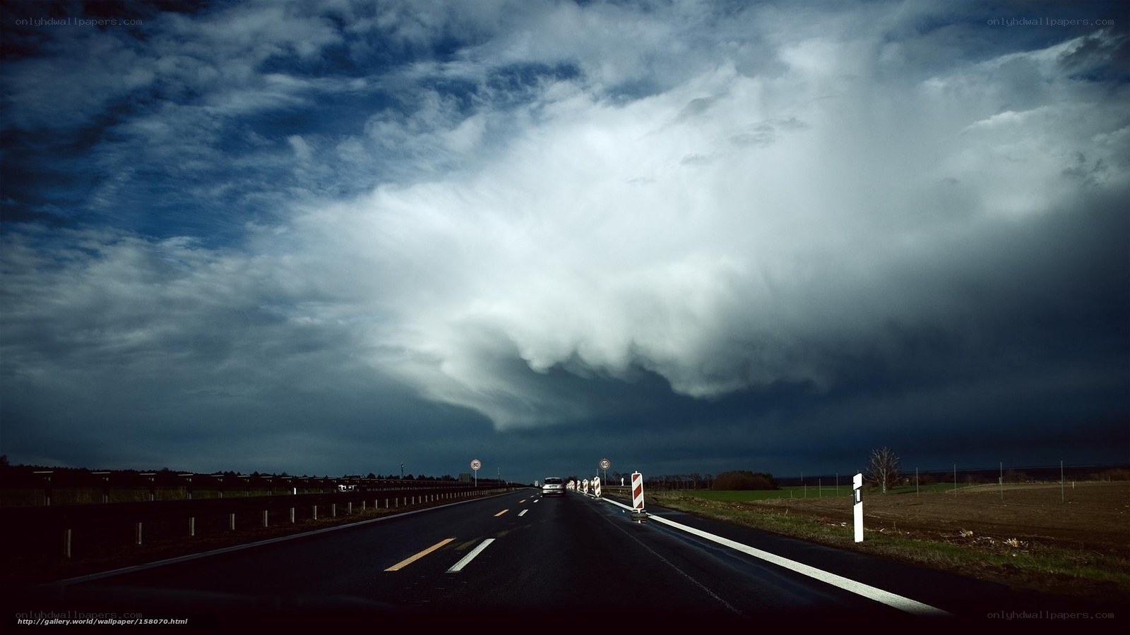 Stormy highway under dark clouds