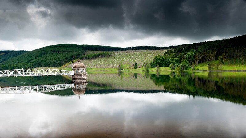 Stormy lake with dam structure