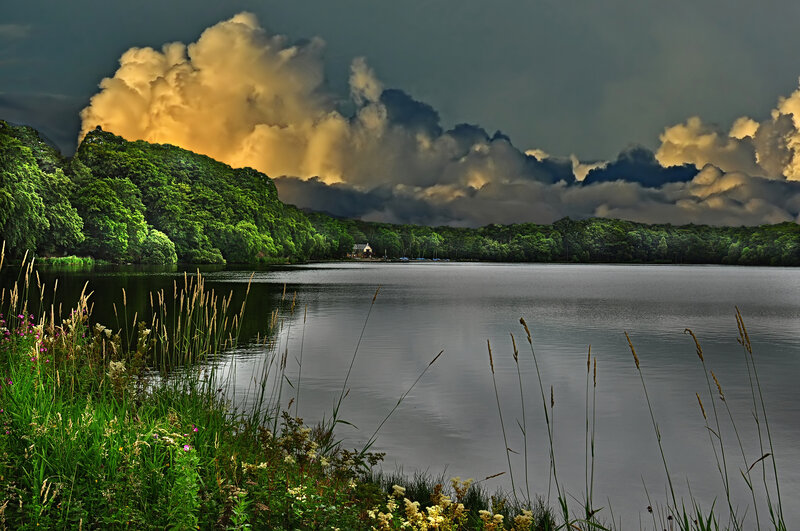 Stormy lake with golden clouds