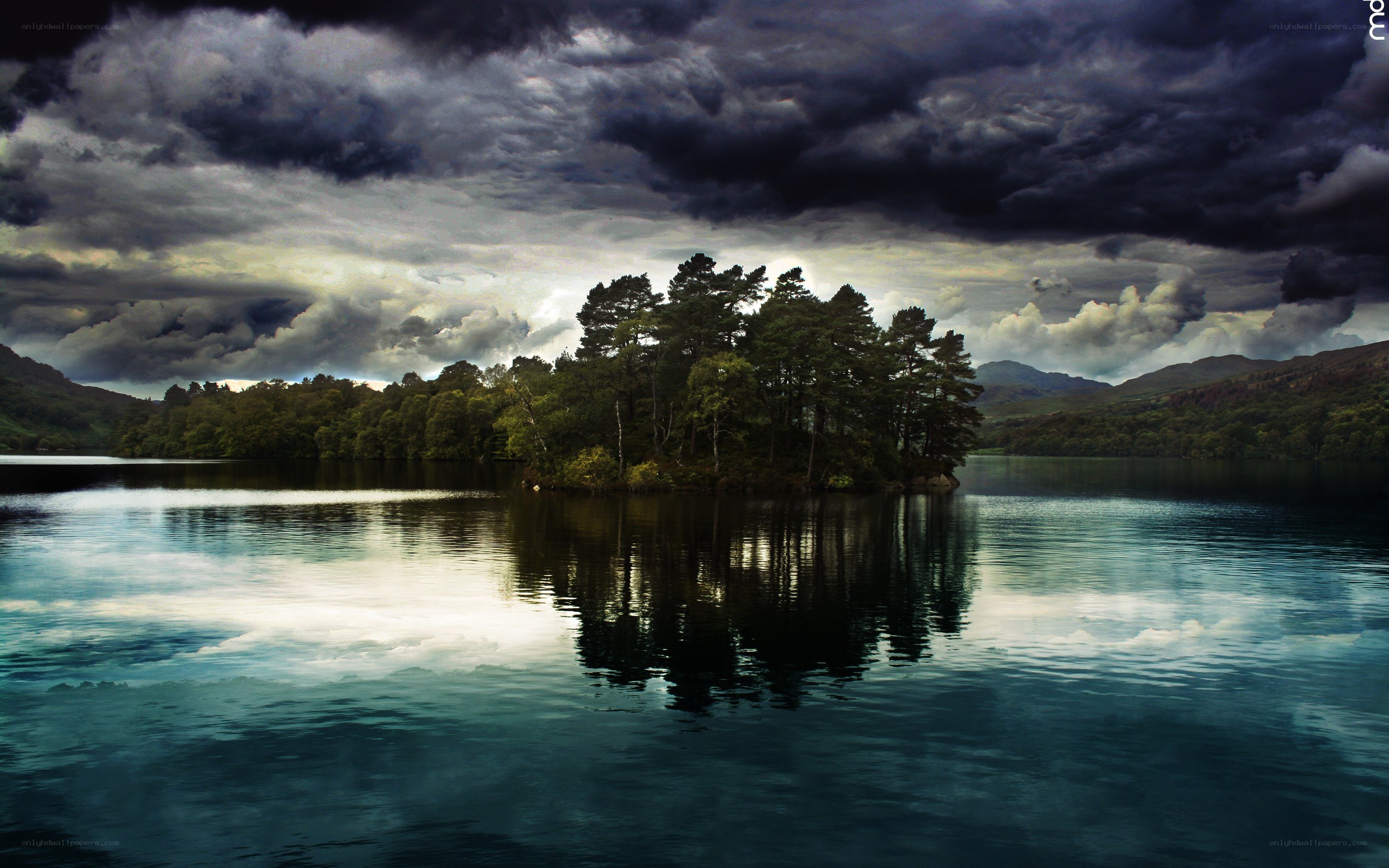 Stormy lake with island reflection