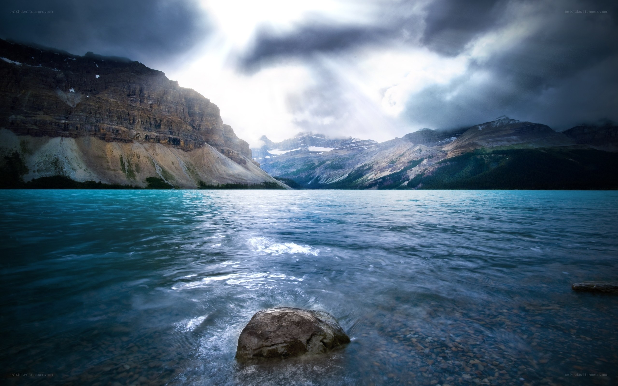 Stormy lake with mountain backdrop