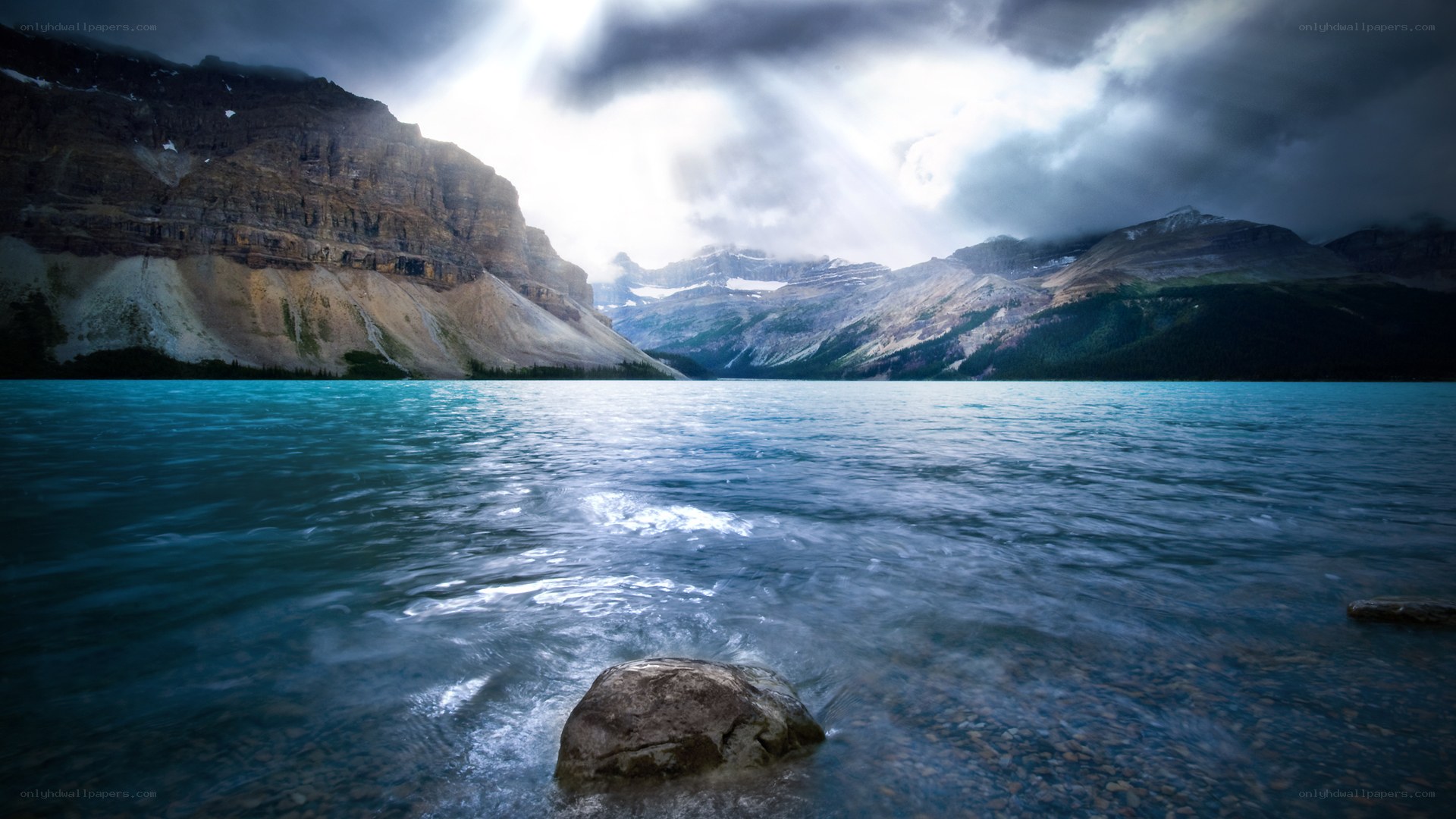 Stormy lake with mountain backdrop