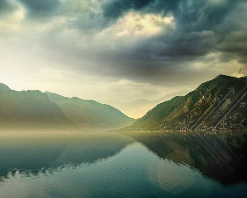 Stormy lake with mountain reflection